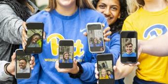 Pitt students holding smartphones