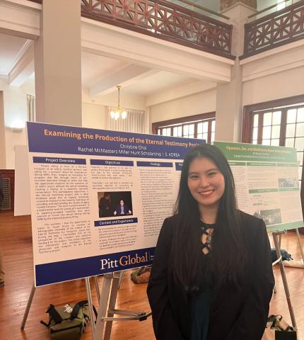 Christine Choi in front of poster board presentation