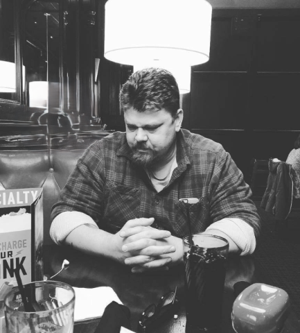 black and white, curtis at a table